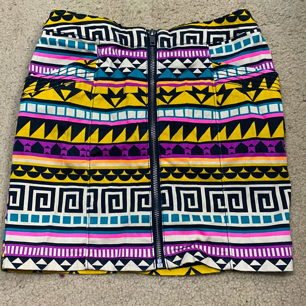 Variety of colors and patterns, size 4. Zipper in the front, worn 2 times